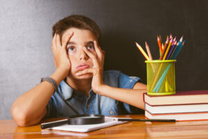 boy with bored expression at school